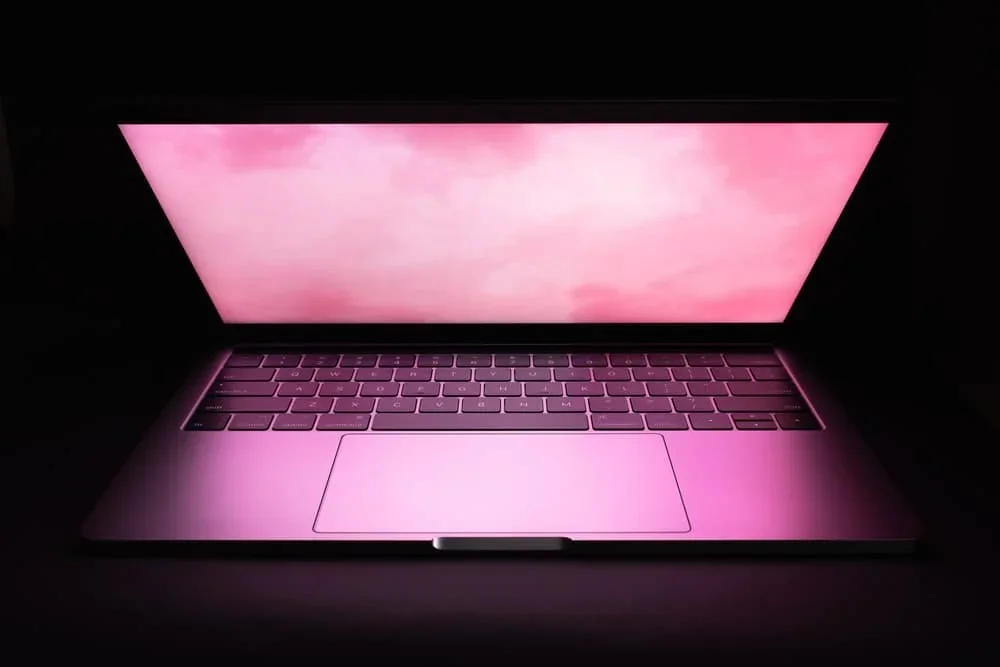A laptop with a pink screen