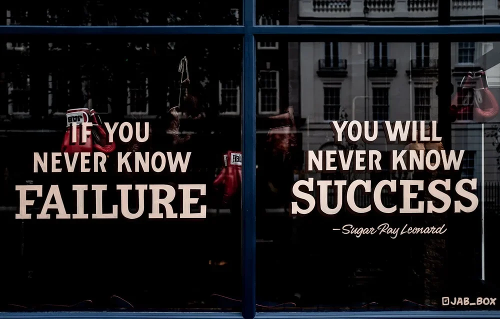 A window with a motivational quote